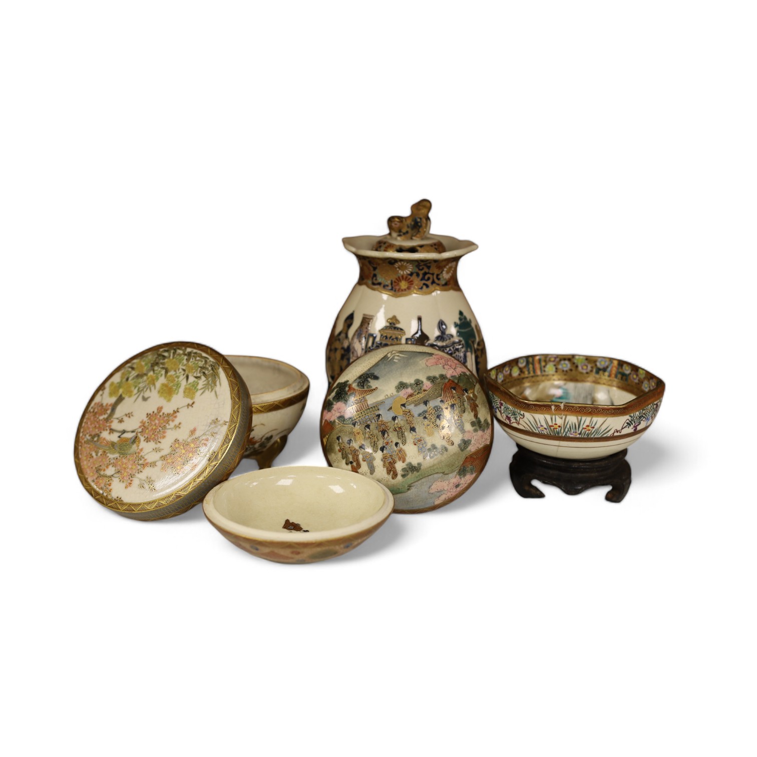 A late 19th century Japanese Satsuma ‘hundred antiques’ gosu blue pot pourri vase and three later items of Satsuma, including a bowl and cover a bowl on stand, a box and cover, tallest 18.5cm high. Condition - vase cover